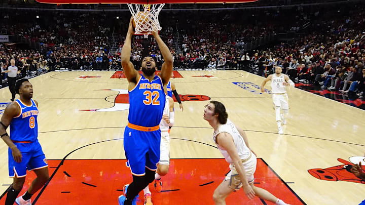 Jan 4, 2025; Chicago, Illinois, USA; New York Knicks center Karl-Anthony Towns (32) shoots the ball against Chicago Bulls guard Josh Giddey (3) during the first half at United Center. Mandatory Credit: David Banks-Imagn Images