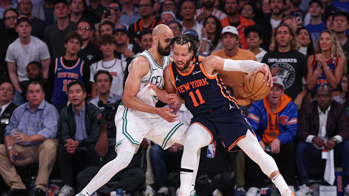New York Knicks guard Jalen Brunson dribbles as Boston Celtics guard Derrick White defends. Mandatory Credit: Vincent Carchietta-Imagn Images