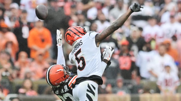 Sep 10, 2023; Cleveland, Ohio, USA; Cleveland Browns cornerback Martin Emerson Jr. (23) and Cincinnati Bengals wide receiver Tee Higgins (5) go for a pass during the second half at Cleveland Browns Stadium. Mandatory Credit: Ken Blaze-USA TODAY Sports Sep 10, 2023; Cleveland, Ohio, USA; Cleveland Browns cornerback Martin Emerson Jr. (23) and Cincinnati Bengals wide receiver Tee Higgins (5) go for a pass during the second half at Cleveland Browns Stadium. Mandatory Credit: Ken Blaze-USA TODAY Sports