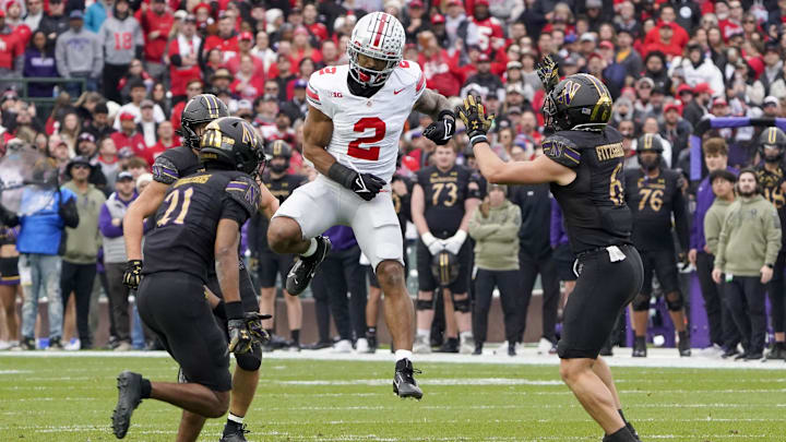 Nov 16, 2024; Chicago, Illinois, USA; Ohio State Buckeyes wide receiver Emeka Egbuka (2) is defended by Northwestern Wildcats defensive back Robert Fitzgerald (6) during the first half at Wrigley Field. Mandatory Credit: David Banks-Imagn Images