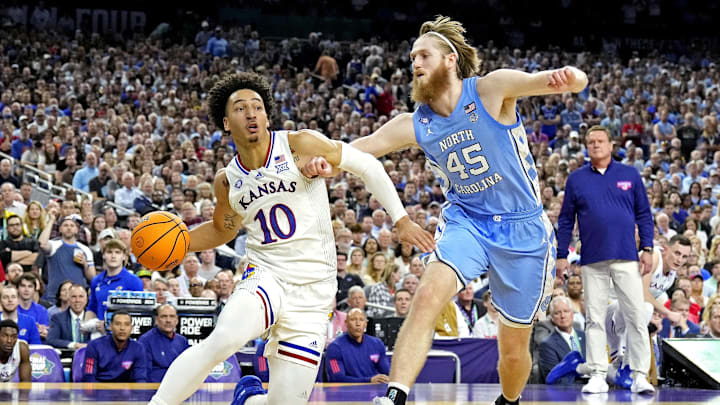 Apr 4, 2022; New Orleans, LA, USA; Kansas Jayhawks forward Jalen Wilson (10) drives to the basket against North Carolina Tar Heels forward Brady Manek (45) during the 2022 NCAA men's basketball tournament Final Four championship game at Caesars Superdome. Mandatory Credit: Robert Deutsch-Imagn Images
