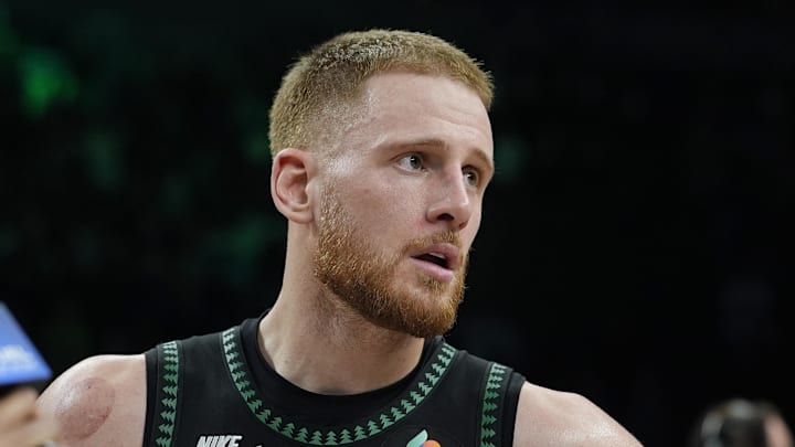 Mar 25, 2026; Minneapolis, Minnesota, USA; Minnesota Timberwolves guard Donte DiVincenzo (0) talks with a reporter after the game with the Houston Rockets at Target Center. Mandatory Credit: Bruce Kluckhohn-Imagn Images