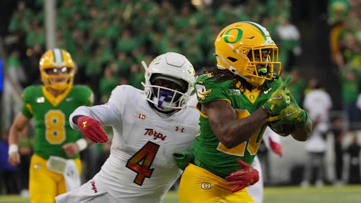 Maryland's Ruben Hyppolite II uses his 4.39-second 40 speed to track down Oregon’s Jordan James.