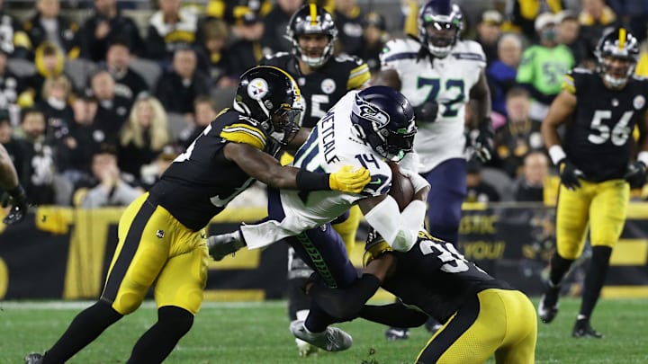 Seahawks wide receiver DK Metcalf (14) is tackled after a catch by the Steelers in 2021.