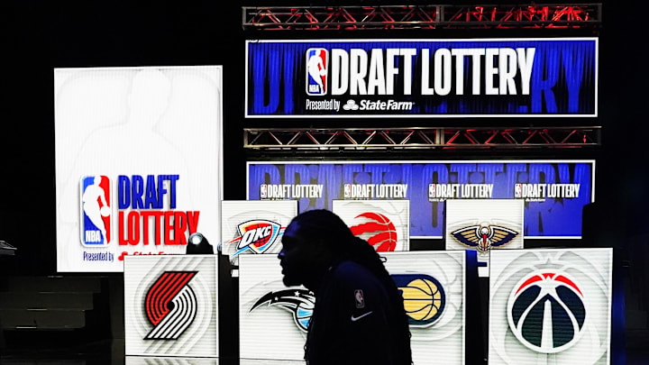 May 16, 2023; Chicago, IL, USA; People walk past the 2023 NBA Draft Lottery board at McCormick Place West. Mandatory Credit: David Banks-Imagn Images May 16, 2023; Chicago, IL, USA; People walk past the 2023 NBA Draft Lottery board at McCormick Place West. Mandatory Credit: David Banks-Imagn Images