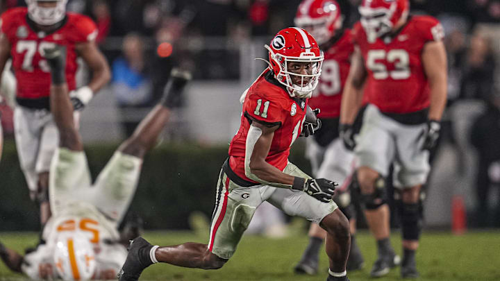 Nov 16, 2024; Athens, Georgia, USA; Georgia Bulldogs wide receiver Arian Smith (11) runs after a catch against the Tennessee Volunteers during the second half at Sanford Stadium. Mandatory Credit: Dale Zanine-Imagn Images Nov 16, 2024; Athens, Georgia, USA; Georgia Bulldogs wide receiver Arian Smith (11) runs after a catch against the Tennessee Volunteers during the second half at Sanford Stadium. Mandatory Credit: Dale Zanine-Imagn Images