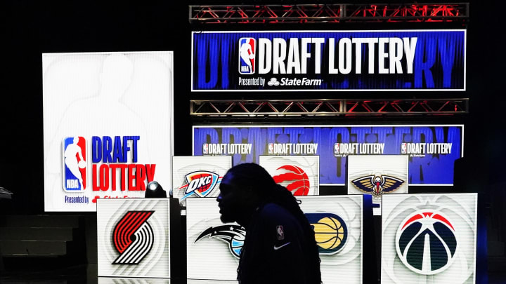 May 16, 2023; Chicago, IL, USA; People walk past the 2023 NBA Draft Lottery board at McCormick Place May 16, 2023; Chicago, IL, USA; People walk past the 2023 NBA Draft Lottery board at McCormick Place