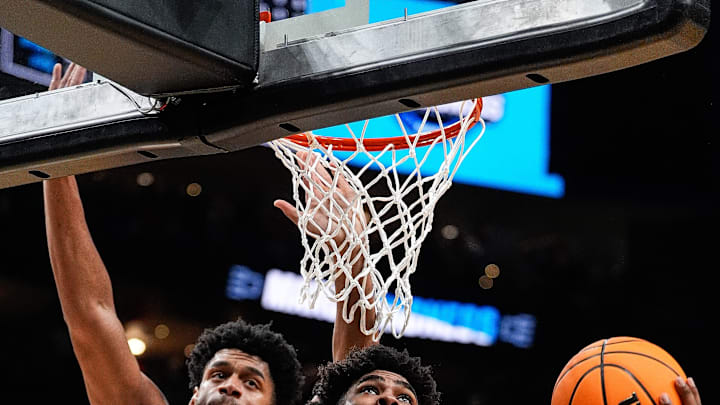 Michigan State guard Jase Richardson (11) goes to the basket against Auburn center Dylan Cardwell (44) during the second half of the Elite Eight round of NCAA tournament at State Farm Arena in Atlanta, Ga. on Sunday, March 30, 2025. Michigan State guard Jase Richardson (11) goes to the basket against Auburn center Dylan Cardwell (44) during the second half of the Elite Eight round of NCAA tournament at State Farm Arena in Atlanta, Ga. on Sunday, March 30, 2025.