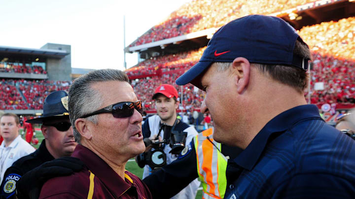 Nov 28, 2014; Tucson, AZ, USA; Arizona State Sun Devils head coach Todd Graham and Arizona Wildcats head coach Rich Rodriguez shake hands after the game at Arizona Stadium.  The Wildcats beat the Sun Devils 42-35 Mandatory Credit: Matt Kartozian-Imagn Images
