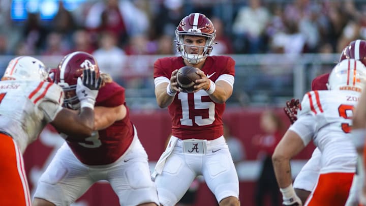 Nov 16, 2024; Tuscaloosa, Alabama, USA; Alabama Crimson Tide quarterback Ty Simpson (15) receives a snapped ball against the Mercer Bears during the third quarter at Bryant-Denny Stadium. Mandatory Credit: Will McLelland-Imagn Images