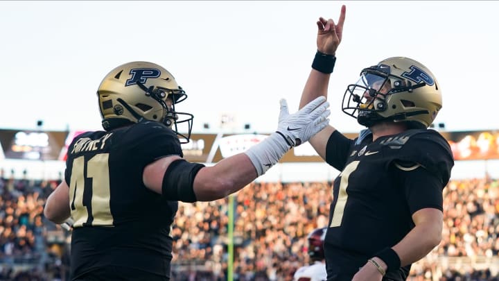 Purdue Boilermakers quarterback Hudson Card celebrates with tight end Ben Furtney Purdue Boilermakers quarterback Hudson Card celebrates with tight end Ben Furtney