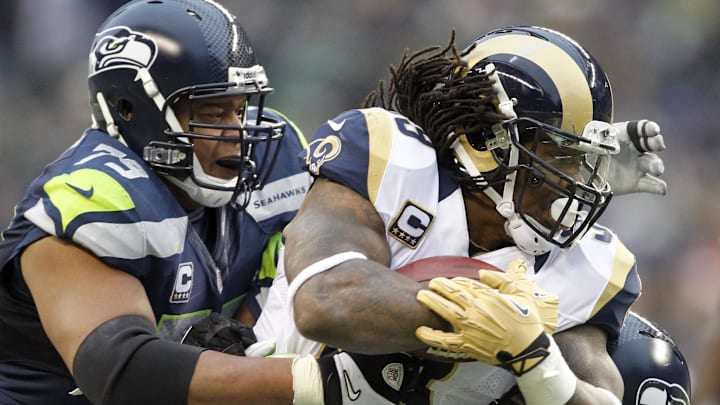 Dec 30, 2012, Seattle, WA, USA; St. Louis Rams running back Steven Jackson (39) is tackled by Seattle Seahawks defensive end Red Bryant (79) during the third quarter at CenturyLink Field. Mandatory Credit: Joe Nicholson-Imagn Images