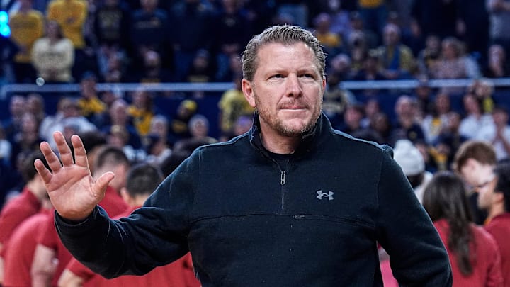 Michigan football offensive coordinator Jason Beck waves at the crowd during football head coach Kyle Whittingham’s introduction during the first half between Michigan and USC at Crisler Center in Ann Arbor on Friday, Jan. 2, 2026.