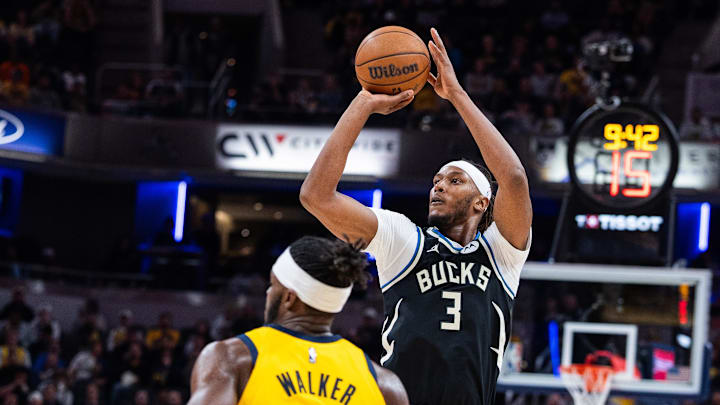 Nov 3, 2025; Indianapolis, Indiana, USA; Milwaukee Bucks center/forward Myles Turner (3) shoots the ball while Indiana Pacers forward Jarace Walker (5) defends in the second half at Gainbridge Fieldhouse. Mandatory Credit: Trevor Ruszkowski-Imagn Images