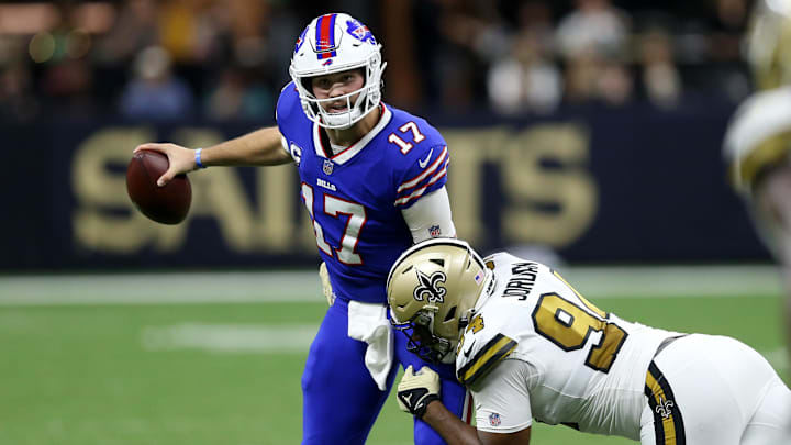 Nov 25, 2021; New Orleans, Louisiana, USA; Buffalo Bills quarterback Josh Allen (17) is almost sacked by New Orleans Saints defensive end Cameron Jordan (94) in the second quarter at the Caesars Superdome. Mandatory Credit: Chuck Cook-Imagn Images