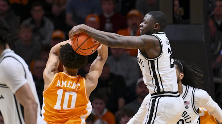Feb 21, 2026; Nashville, Tennessee, USA;  Vanderbilt Commodores guard Duke Miles (2) ties up Tennessee Volunteers forward Nate Ament (10) as he goes to the basket during the second half at Memorial Gymnasium. Mandatory Credit: Steve Roberts-Imagn Images