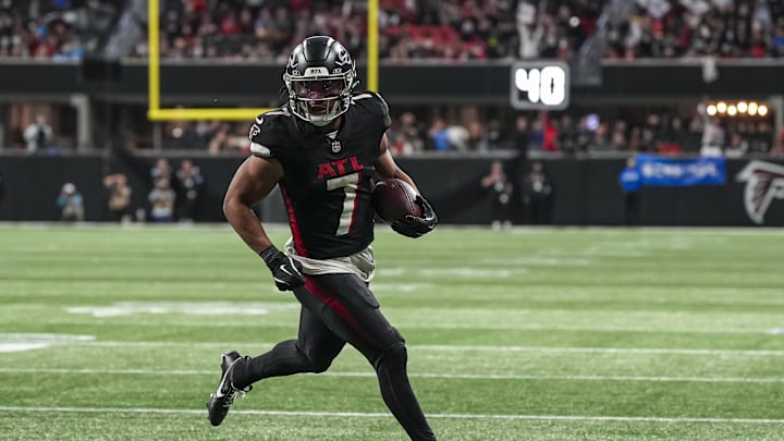 Jan 5, 2025; Atlanta, Georgia, USA; Atlanta Falcons running back Bijan Robinson (7) runs for a touchdown against the Carolina Panthers during the second half at Mercedes-Benz Stadium. Mandatory Credit: Dale Zanine-Imagn Images