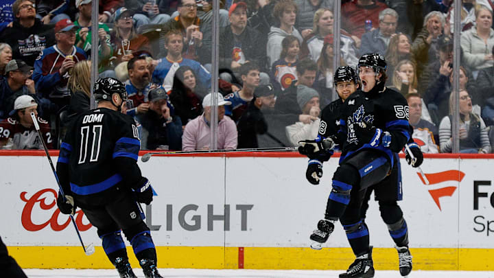 Feb 24, 2024; Denver, Colorado, USA; Toronto Maple Leafs left wing Tyler Bertuzzi (59) celebrates his goal with center Max Domi (11) and right-winger William Nylander (88) in the second period against the Colorado Avalanche at Ball Arena. Mandatory Credit: Isaiah J. Downing-USA TODAY Sports