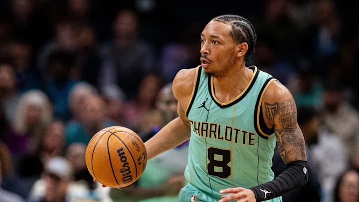 Jan 25, 2025; Charlotte, North Carolina, USA; Charlotte Hornets guard Nick Smith Jr. (8) brings the ball up court against the New Orleans Pelicans during the first quarter at Spectrum Center. Mandatory Credit: Scott Kinser-Imagn Images