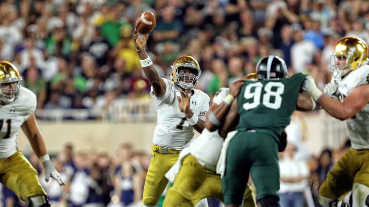 Sep 23, 2017; East Lansing, MI, USA; Notre Dame Fighting Irish quarterback Brandon Wimbush (7) attempts to throw the ball during the first half a game against the Michigan State Spartans at Spartan Stadium. Sep 23, 2017; East Lansing, MI, USA; Notre Dame Fighting Irish quarterback Brandon Wimbush (7) attempts to throw the ball during the first half a game against the Michigan State Spartans at Spartan Stadium.