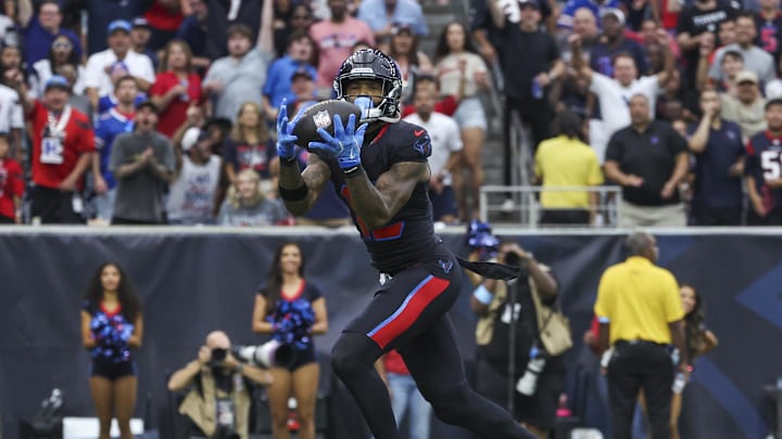 Oct 6, 2024; Houston, Texas, USA; Houston Texans wide receiver Nico Collins (12) makes a reception for a touchdown during the first quarter against the Buffalo Bills at NRG Stadium. Mandatory Credit: Troy Taormina-Imagn Images
