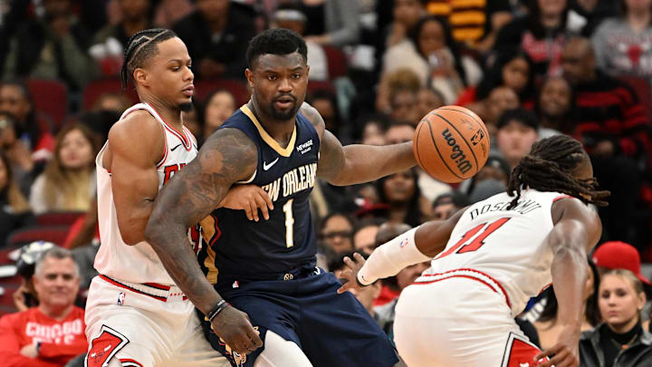 Dec 31, 2025; Chicago, Illinois, USA; New Orleans Pelicans forward Zion Williamson (1) controls the ball against Chicago Bulls forward Isaac Okoro (35) and guard Ayo Dosunmu (11) during the first half at United Center. Mandatory Credit: Patrick Gorski-Imagn Images