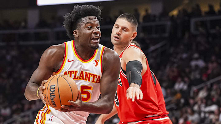 Nov 9, 2024; Atlanta, Georgia, USA; Atlanta Hawks center Clint Capela (15) goes to the basket past Chicago Bulls center Nikola Vucevic (9) during the first half at State Farm Arena. Mandatory Credit: Dale Zanine-Imagn Images