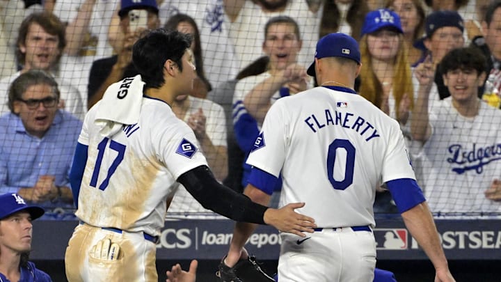 Oct 13, 2024; Los Angeles, California, USA; Los Angeles Dodgers two-way player Shohei Ohtani (17) reacts after pitcher Jack Flaherty (0) walks to the dug out in the seventh inning during game one of the NLCS for the 2024 MLB Playoffs at Dodger Stadium. Oct 13, 2024; Los Angeles, California, USA; Los Angeles Dodgers two-way player Shohei Ohtani (17) reacts after pitcher Jack Flaherty (0) walks to the dug out in the seventh inning during game one of the NLCS for the 2024 MLB Playoffs at Dodger Stadium.