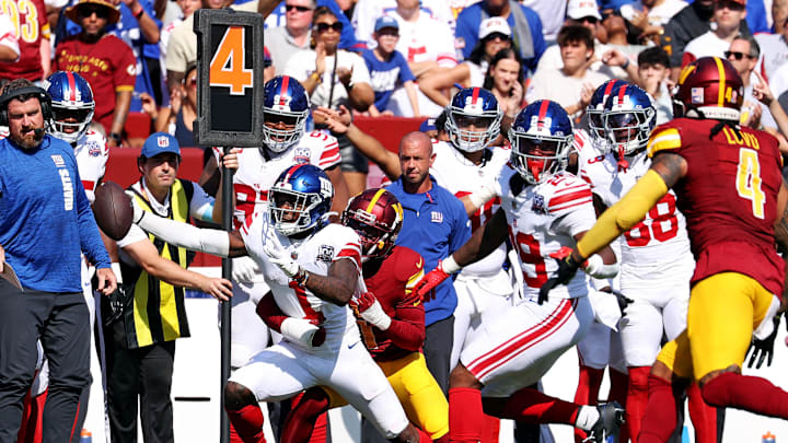 Sep 15, 2024; Landover, Maryland, USA; New York Giants wide receiver Malik Nabers (1) reaches for a first down during the fourth quarter against the Washington Commanders.