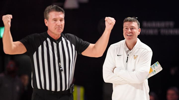 Feb 11, 2025; Nashville, Tennessee, USA;  Vanderbilt Commodores head coach Mark Byington reacts after a foul called against the Auburn Tigers during the first half at Memorial Gymnasium. Mandatory Credit: Steve Roberts-Imagn Images