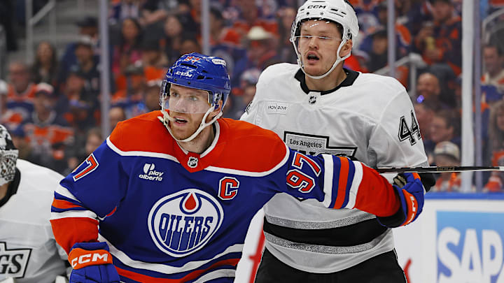 May 1, 2025; Edmonton, Alberta, CAN; Edmonton Oilers forward Connor McDavid (97) and Los Angeles Kings defensemen Mikey Anderson (44) battles for position during the third period in game six of the first round of the 2025 Stanley Cup Playoffs at Rogers Place. Mandatory Credit: Perry Nelson-Imagn Images