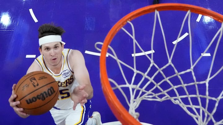 Mar 8, 2026; Los Angeles, California, USA; Los Angeles Lakers guard Austin Reaves (15) shoots the ball against the New York Knicks in the first half at Crypto.com Arena. Mandatory Credit: Kirby Lee-Imagn Images