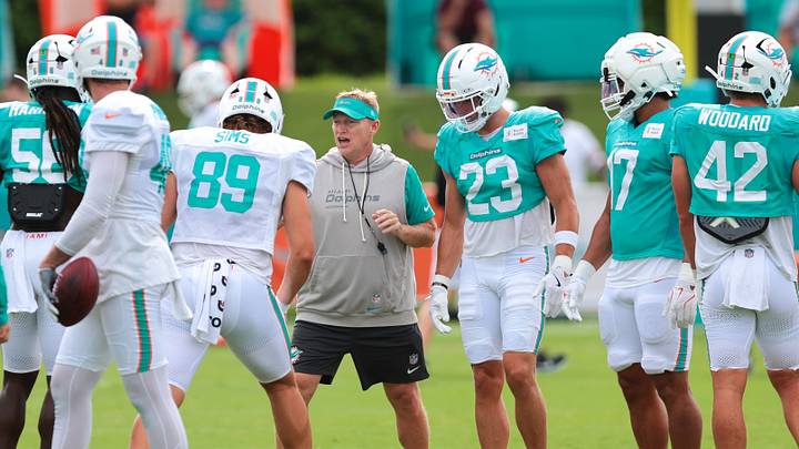 Miami Dolphins special teams coordinator Chris Tabor works with tight end Ben Sims (89) during practice at the Baptist Health Training Complex. Miami Dolphins special teams coordinator Chris Tabor works with tight end Ben Sims (89) during practice at the Baptist Health Training Complex.