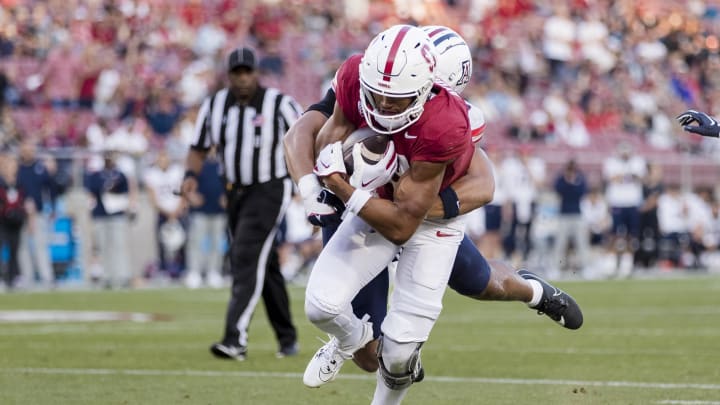 Sep 23, 2023; Stanford, California, USA; Stanford Cardinal wide receiver Elic Ayomanor (13) runs the ball for a touchdown against the Arizona Wildcats during the third quarter at Stanford Stadium. Mandatory Credit: John Hefti-USA TODAY Sports Sep 23, 2023; Stanford, California, USA; Stanford Cardinal wide receiver Elic Ayomanor (13) runs the ball for a touchdown against the Arizona Wildcats during the third quarter at Stanford Stadium. Mandatory Credit: John Hefti-USA TODAY Sports