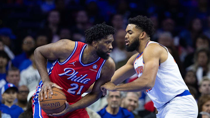 Nov 12, 2024; Philadelphia, Pennsylvania, USA; Philadelphia 76ers center Joel Embiid (21) controls the ball against New York Knicks center Karl-Anthony Towns (32) during the first quarter at Wells Fargo Center. Mandatory Credit: Bill Streicher-Imagn Images