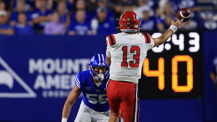 Sep 5, 2026; Provo, Utah, USA;  Utah Tech Trailblazers quarterback Bronson Barben (13) throws a pass against BYU Cougars linebacker Blake Lowe (55) during the second half at LaVell Edwards Stadium.  Mandatory Credit: Rob Gray-Imagn Images