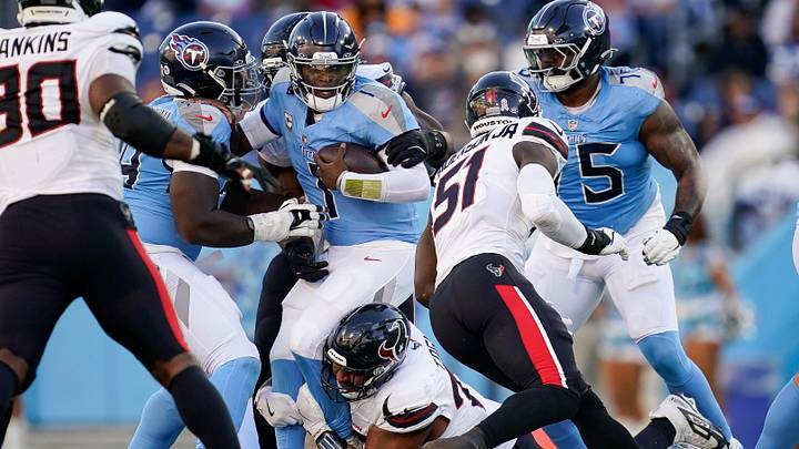 Tennessee Titans quarterback Cam Ward (1) is sacked by Houston Texans defensive tackle Tommy Togiai (72) during the fourth quarter at Nissan Stadium in Nashville, Tenn., Sunday, Nov. 16, 2025. Tennessee Titans quarterback Cam Ward (1) is sacked by Houston Texans defensive tackle Tommy Togiai (72) during the fourth quarter at Nissan Stadium in Nashville, Tenn., Sunday, Nov. 16, 2025.
