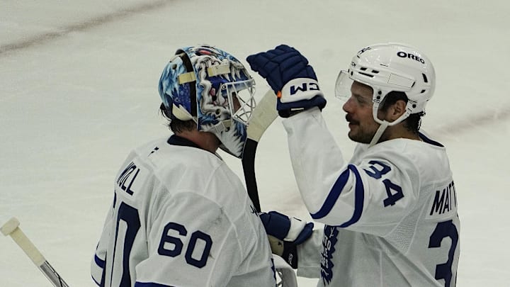 Feb 23, 2025; Chicago, Illinois, USA; Toronto Maple Leafs goaltender Joseph Woll (60) and center Auston Matthews (34) celebrate their win against the Chicago Blackhawks at United Center. Mandatory Credit: David Banks-Imagn Images