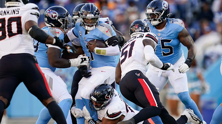 Tennessee Titans quarterback Cam Ward (1) is sacked by Houston Texans defensive tackle Tommy Togiai (72) during the fourth quarter at Nissan Stadium in Nashville, Tenn., Sunday, Nov. 16, 2025. Tennessee Titans quarterback Cam Ward (1) is sacked by Houston Texans defensive tackle Tommy Togiai (72) during the fourth quarter at Nissan Stadium in Nashville, Tenn., Sunday, Nov. 16, 2025.