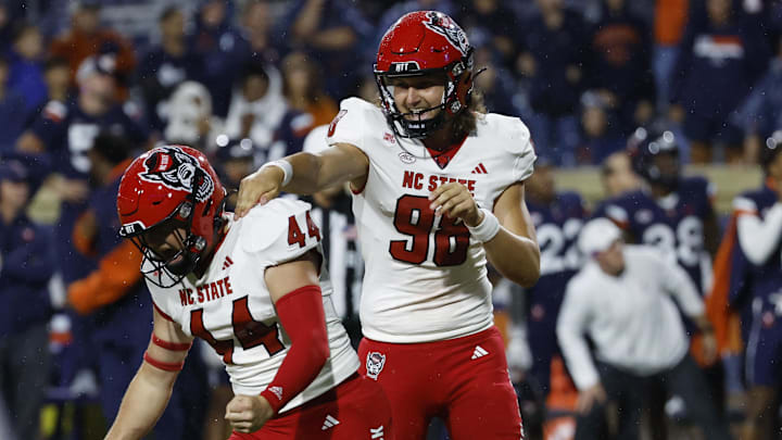 Sep 22, 2023; Charlottesville, Virginia, USA; North Carolina State Wolfpack place kicker Brayden Narveson (44) celebrates with Wolfpack punter Caden Noonkester (98) after making the game winning field goal on the final play of the game against the Virginia Cavaliers at Scott Stadium. Mandatory Credit: Geoff Burke-Imagn Images
