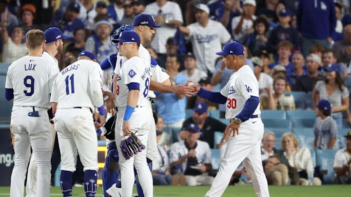 Oct 6, 2024; Los Angeles, California, USA; Los Angeles Dodgers manager Dave Roberts (30) relieves pitcher Jack Flaherty (0) in the sixth inning against the San Diego Padres during game two of the NLDS for the 2024 MLB Playoffs at Dodger Stadium. Mandatory Credit: Kiyoshi Mio-Imagn Images