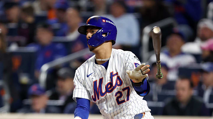Oct 8, 2024; New York City, New York, USA; New York Mets third baseman Mark Vientos (27) hits a single in the sixth inning against the Philadelphia Phillies during game three of the NLDS for the 2024 MLB Playoffs at Citi Field. Mandatory Credit: Vincent Carchietta-Imagn Images