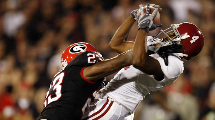September 27, 2008;  Athens, GA, USA; Alabama wide receiver Marquis Maze (4) is defended by Georgia safety Prince Miller (23) the last time the Bulldogs called for a blackout against the Crimson Tide at Sanford Stadium. 