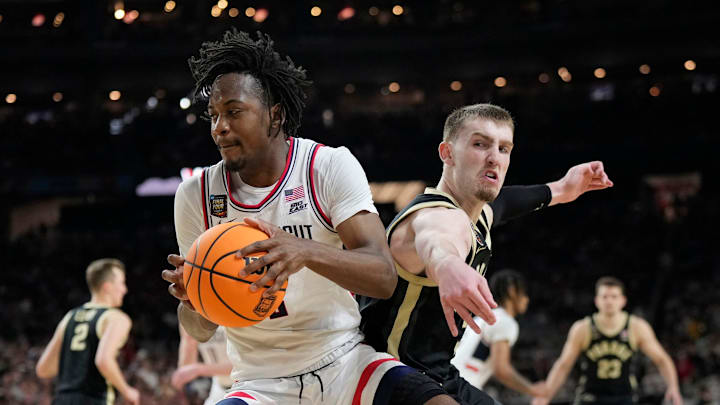 Purdue Boilermakers guard Braden Smith (3) fouls Connecticut Huskies guard Tristen Newton (2) during the Men's NCAA national championship game at State Farm Stadium in Glendale on April 8, 2024. Purdue Boilermakers guard Braden Smith (3) fouls Connecticut Huskies guard Tristen Newton (2) during the Men's NCAA national championship game at State Farm Stadium in Glendale on April 8, 2024.