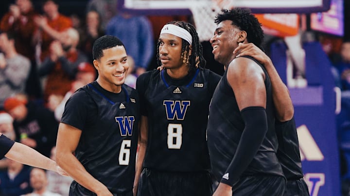 Tyler Harris, middle, is surrounded by fellow Huskies Tyree Ihenacho (6) and Great Osobor, right. Tyler Harris, middle, is surrounded by fellow Huskies Tyree Ihenacho (6) and Great Osobor, right.
