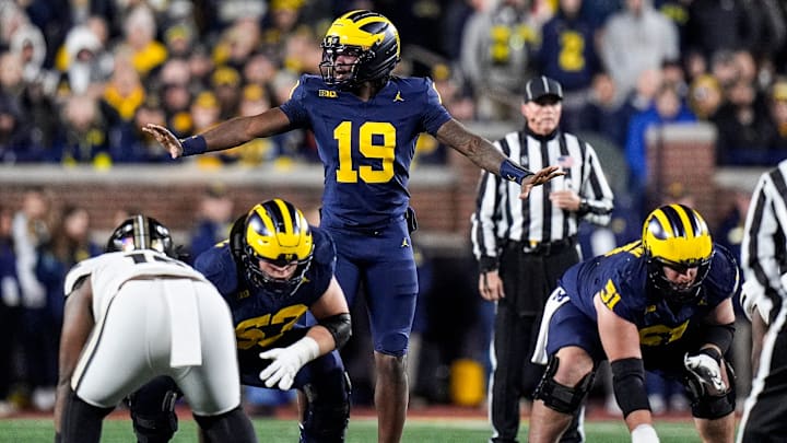 Michigan quarterback Bryce Underwood (19) talks to teammates before a play against Purdue during the second half at Michigan Stadium in Ann Arbor on Saturday, November 1, 2025. Michigan quarterback Bryce Underwood (19) talks to teammates before a play against Purdue during the second half at Michigan Stadium in Ann Arbor on Saturday, November 1, 2025.