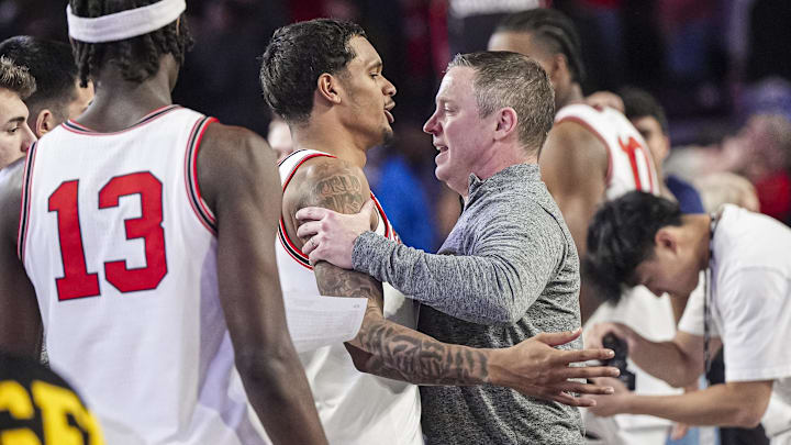 Jan 11, 2025; Athens, Georgia, USA; Georgia Bulldogs guard De'Shayne Montgomery (2) and head coach Mike White react after defeating the Oklahoma Sooners at Stegeman Coliseum. Mandatory Credit: Dale Zanine-Imagn Images