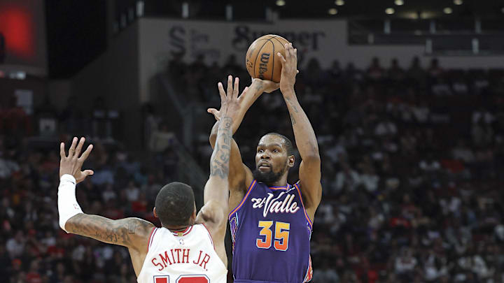 Feb 23, 2024; Houston, Texas, USA; Phoenix Suns forward Kevin Durant (35) shoots the ball as Houston Rockets forward Jabari Smith Jr. (10) defends during the fourth quarter at Toyota Center. Mandatory Credit: Troy Taormina-Imagn Images