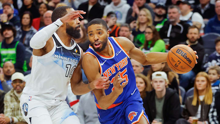 Dec 19, 2024; Minneapolis, Minnesota, USA; New York Knicks forward Mikal Bridges (25) battles Mike Conley (10) to the paint in the first quarter at Target Center. Mandatory Credit: Bruce Kluckhohn-Imagn Images Dec 19, 2024; Minneapolis, Minnesota, USA; New York Knicks forward Mikal Bridges (25) battles Mike Conley (10) to the paint in the first quarter at Target Center. Mandatory Credit: Bruce Kluckhohn-Imagn Images
