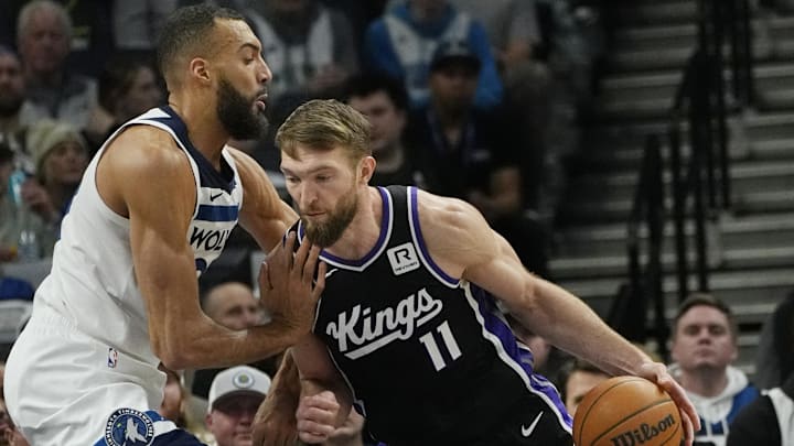 Feb 3, 2025; Minneapolis, Minnesota, USA; Sacramento Kings center Domantas Sabonis (11) works against Minnesota Timberwolves center Rudy Gobert (27) in the first quarter at Target Center. Mandatory Credit: Bruce Kluckhohn-Imagn Images